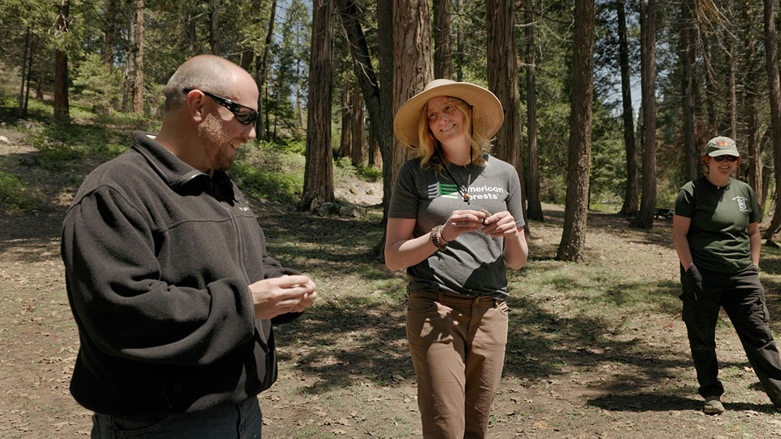 Britta Dyer, vice president of restoration with American Forests, speaks with Wade Bell, Placerville nursery manager with the U.S. Forest Service, during Cone Camp.