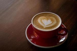 the red cup coffee love , coffee dark in wood dark table photo